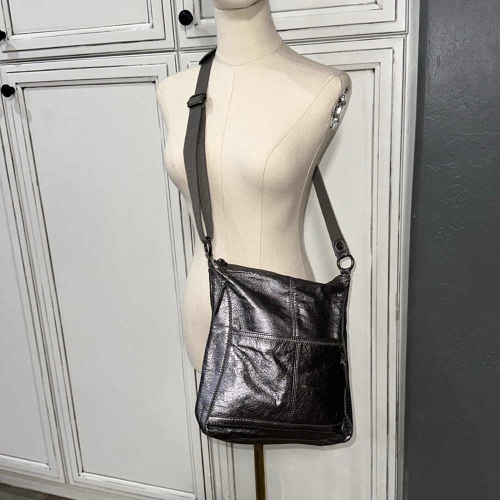 The SAK Pax Metallic Swing Pack Crossbody Bag  silver purse shimmery